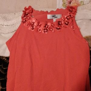 Orange tunic with flower neckline